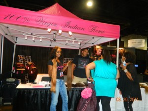 "Maya" Magenta tent with black text. T-shirts on display at Bronner Bros Bonner Brothers Hair Show, Atlanta